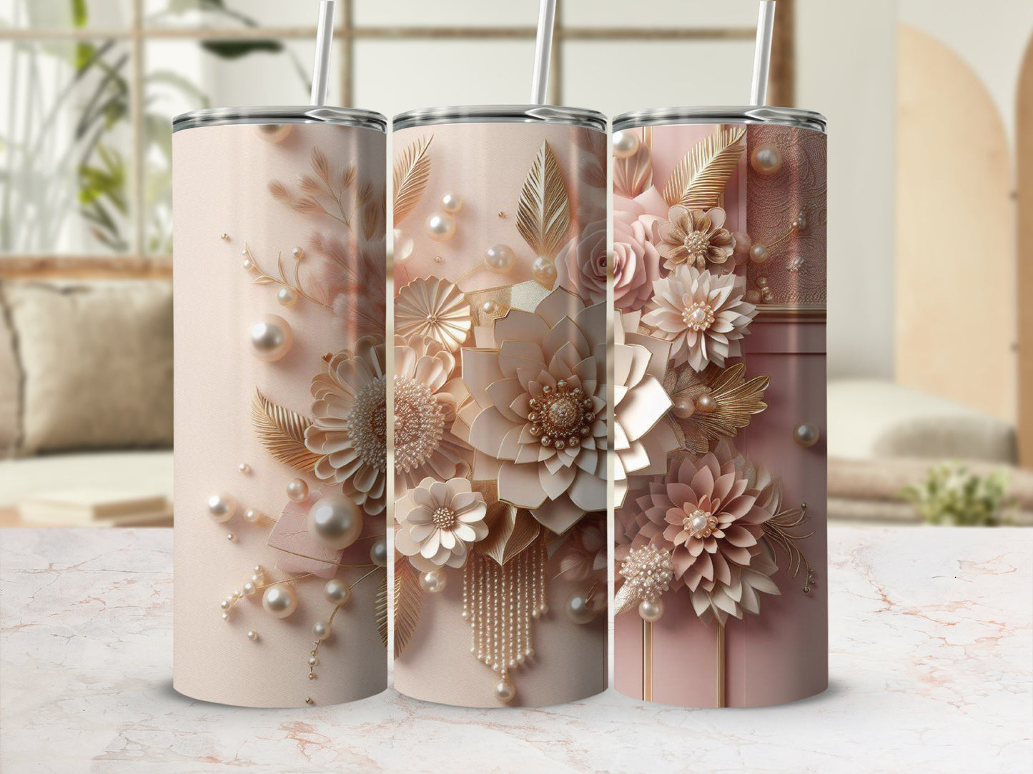 Three blush pink tumblers decorated with pearl and floral embellishments.