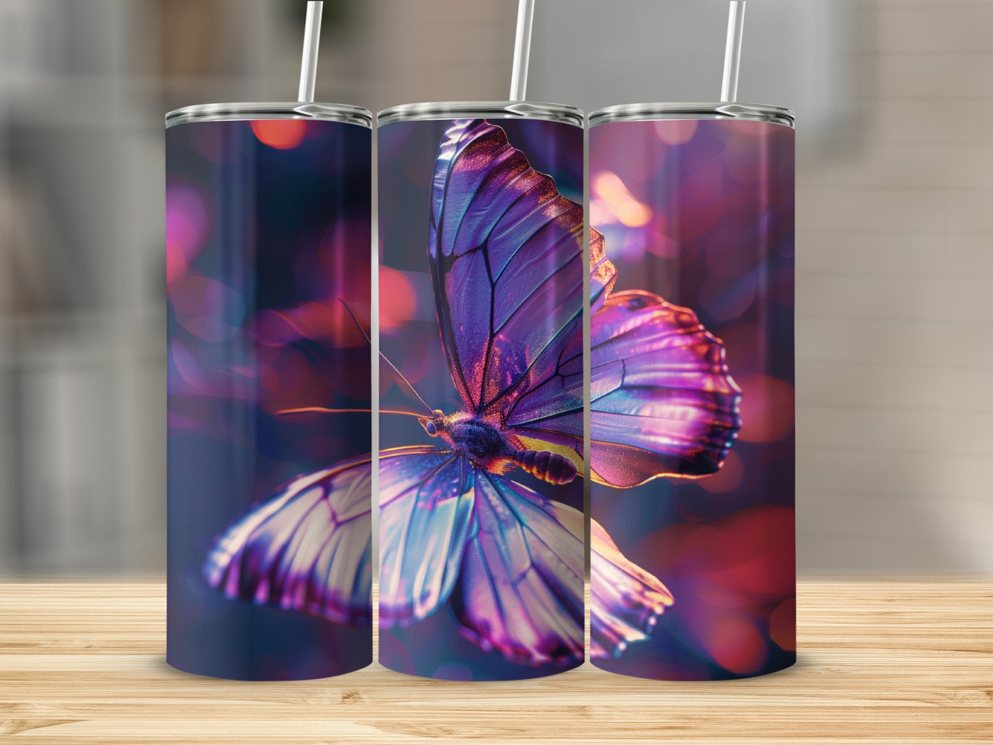 Three tumblers with a purple butterfly design, blurred bokeh background.
