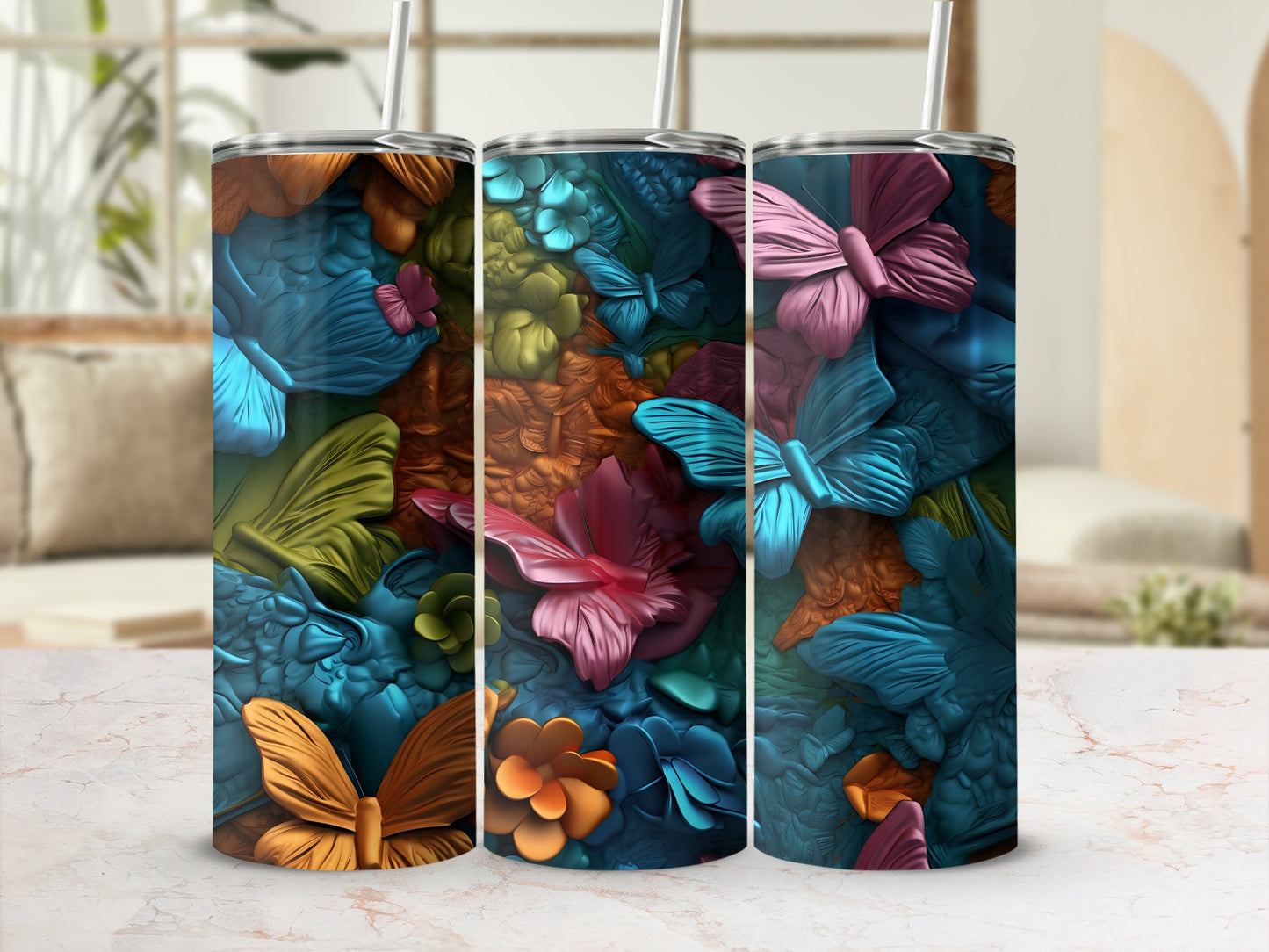 Three tumblers with a textured butterfly and floral design.