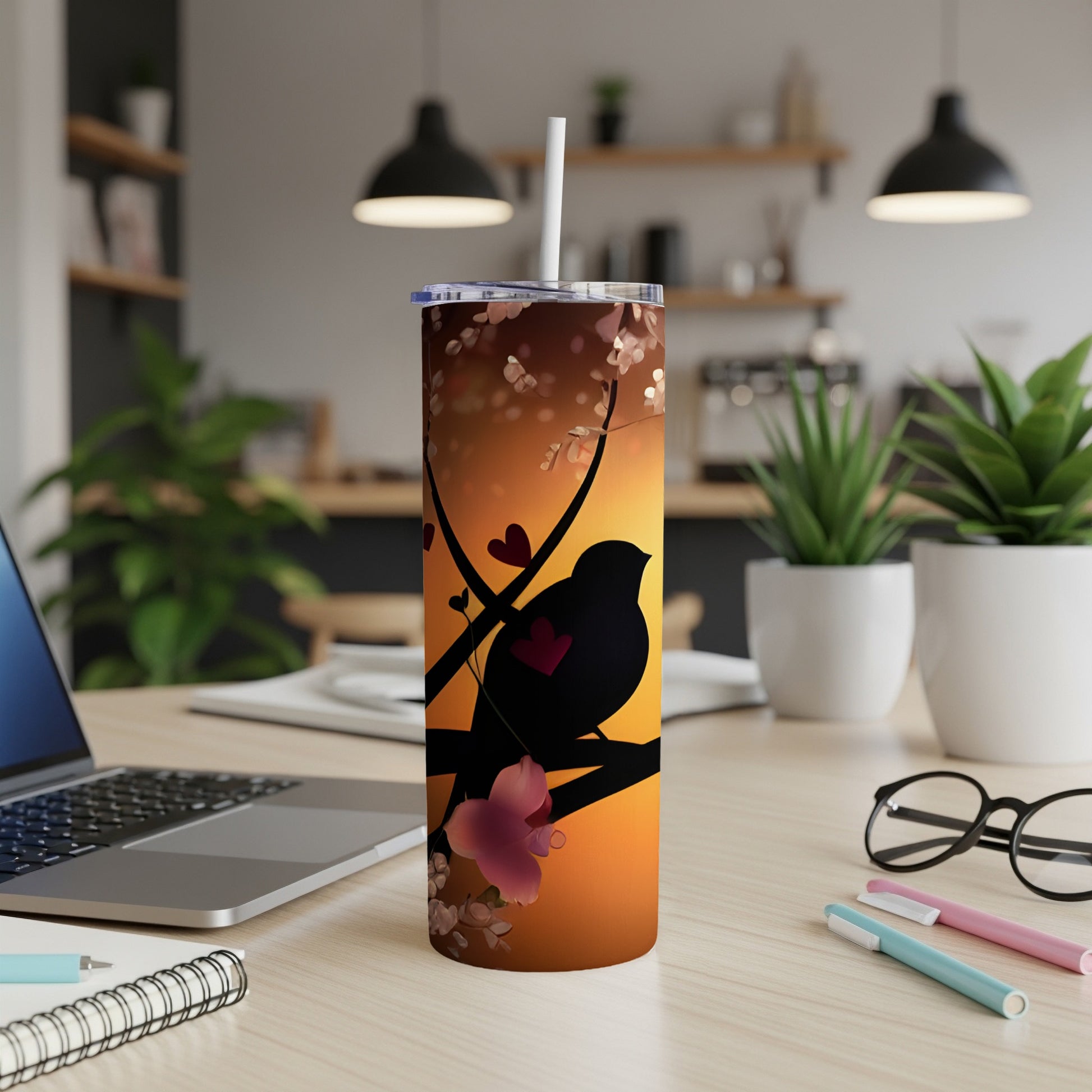 Black bird silhouette on a branch with hearts and cherry blossoms, sunset gradient.