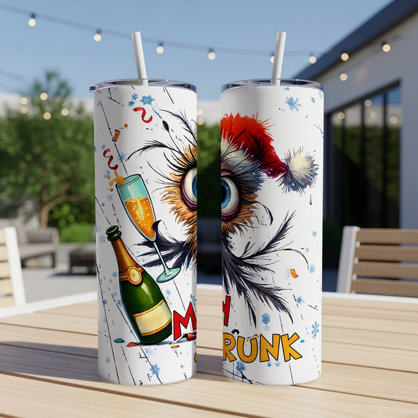 Two tumblers with a festive owl design and champagne for a "Merry Drunk" holiday.