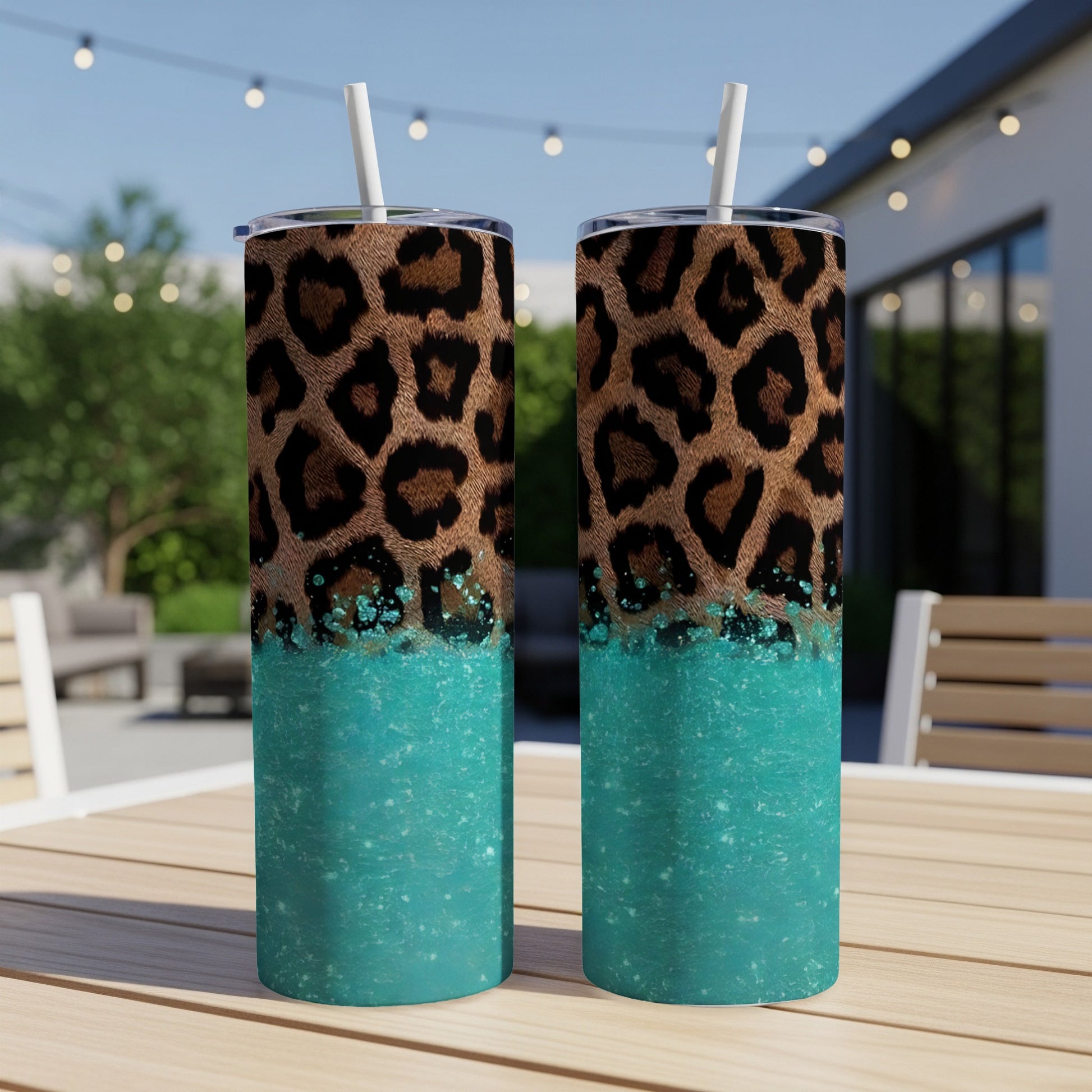 Two tumblers with leopard print and teal glitter designs.