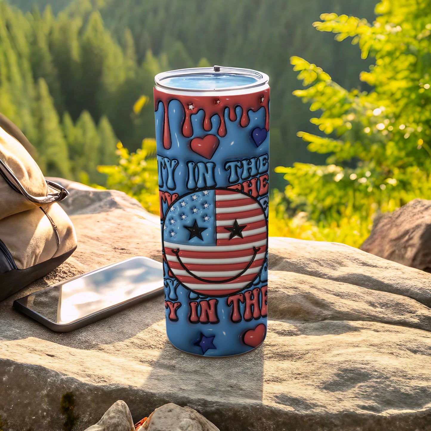 Red, white, and blue tumbler with dripping hearts and a smiley face.