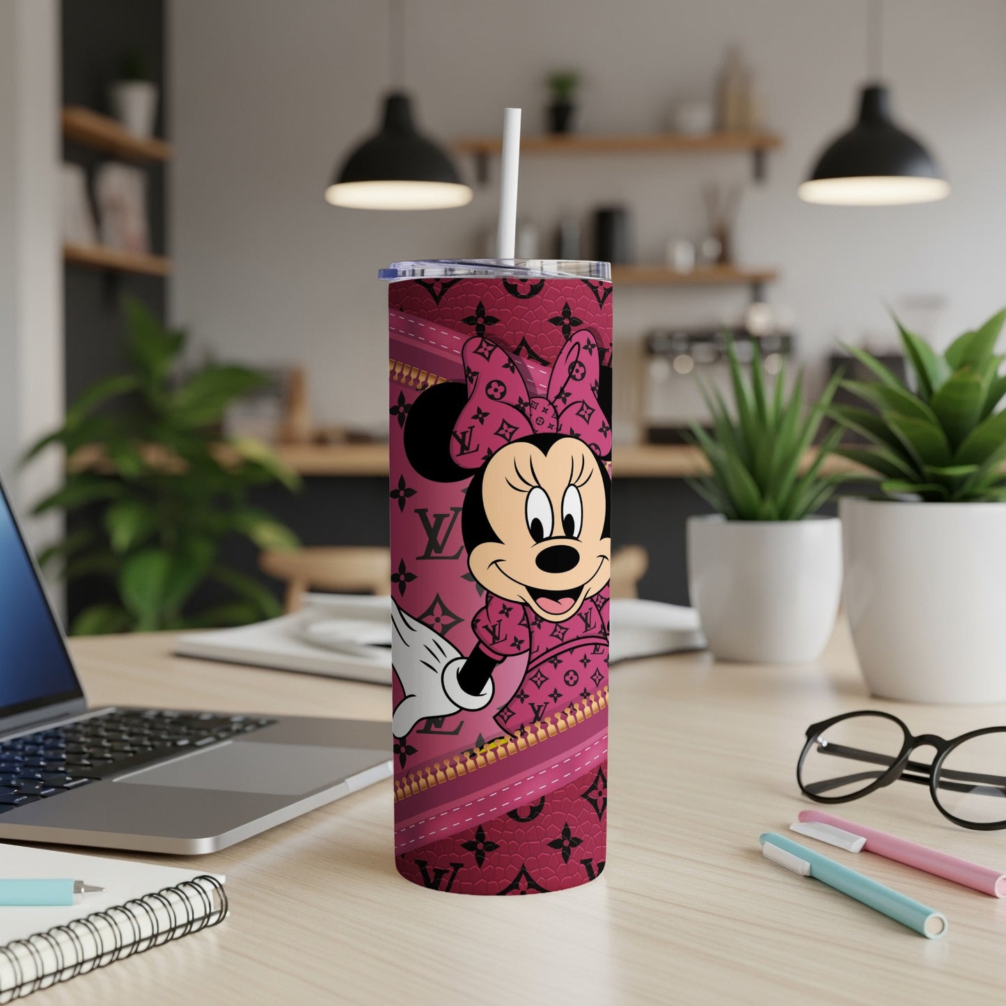 Minnie Mouse on a pink tumbler with Louis Vuitton-inspired pattern.