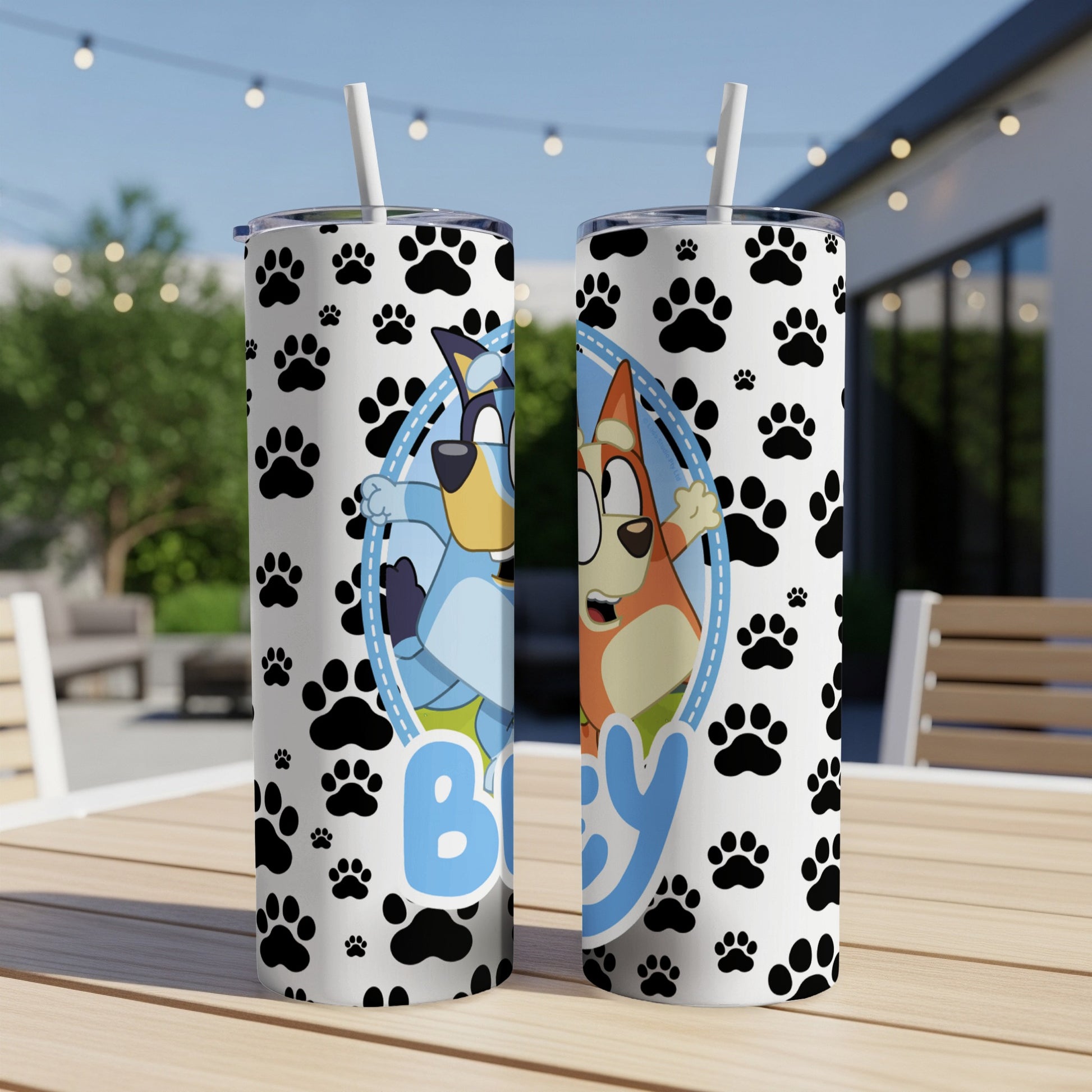 Two tumblers with Bluey and Bingo characters on paw print background.