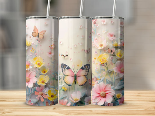 Three tumblers with butterfly and floral designs on a wooden surface.