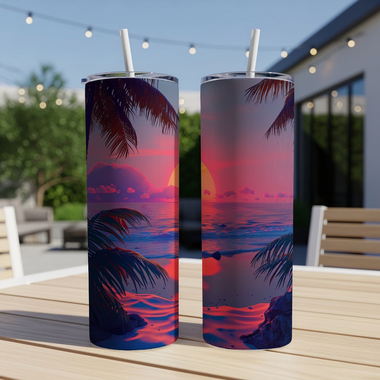 Two tall tumblers with a sunset beach scene, standing on a table.