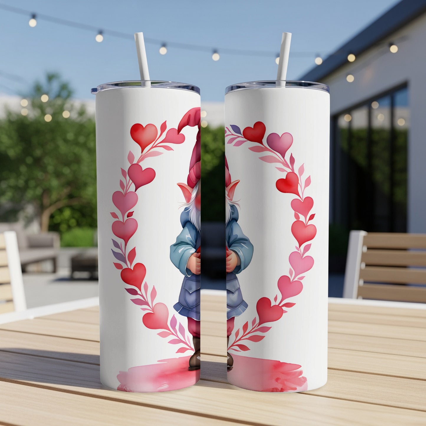 Two tumblers with a gnome inside a heart-shaped wreath of hearts.