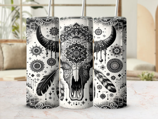 Black and white bull skull with mandala and feather design on tumbler.