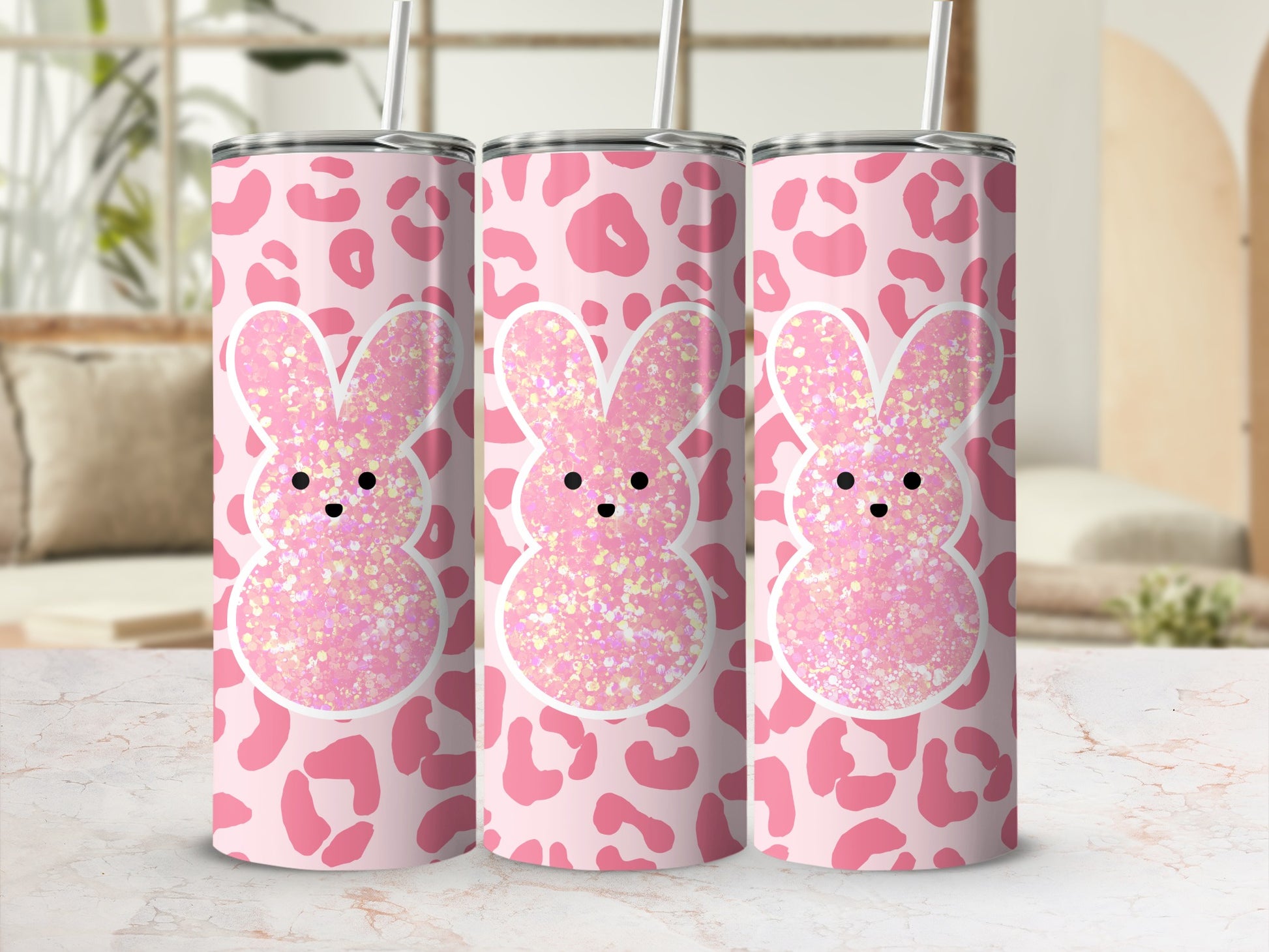 Pink cheetah print tumbler with glitter bunny design and straw.