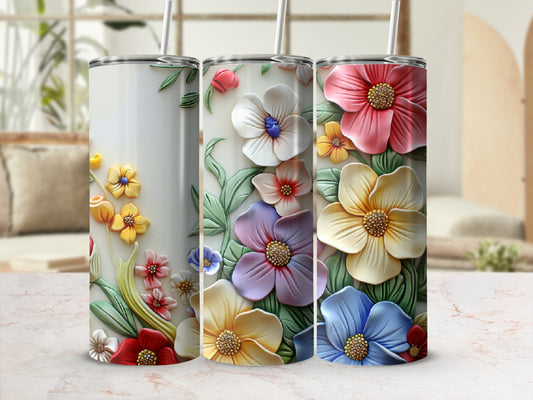 Three tumblers with raised floral designs in pink, yellow, blue, and purple.