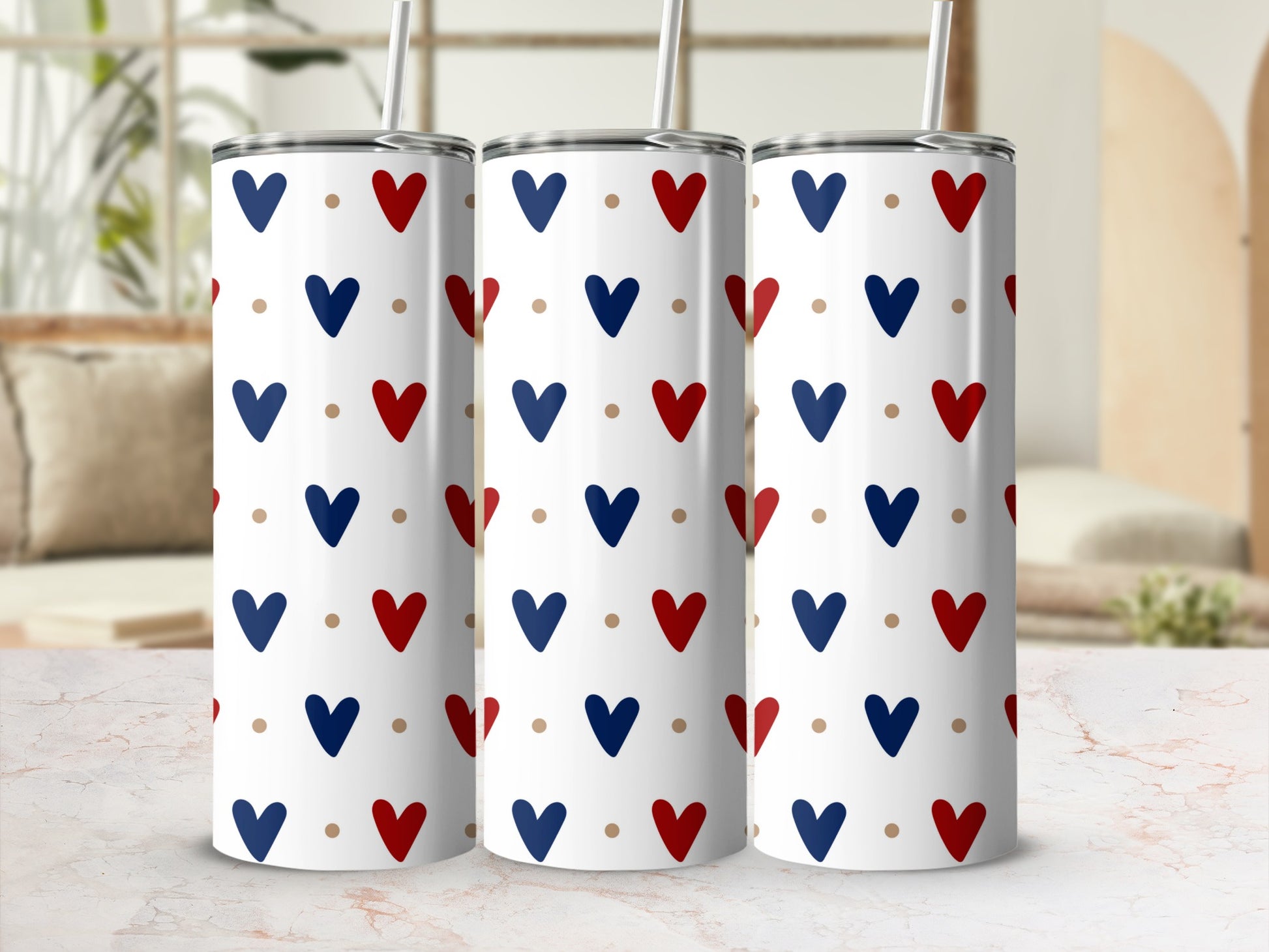 Three white tumblers with red and blue heart pattern.