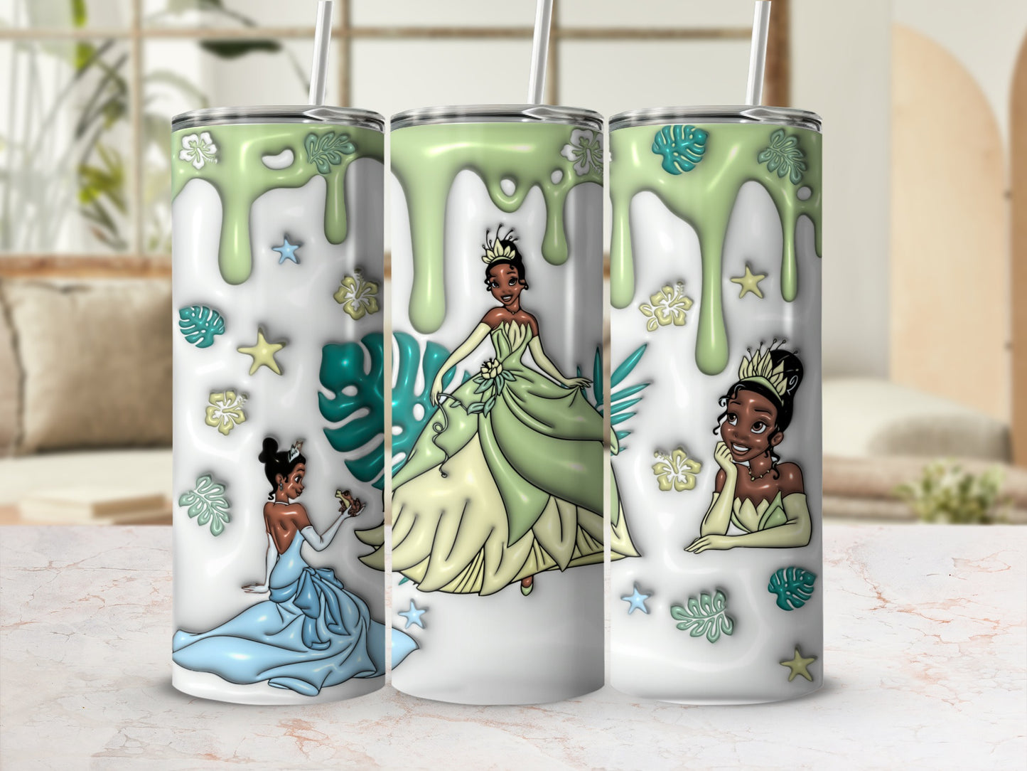 Tiana in blue and green ballgowns with tropical leaves on tumblers.