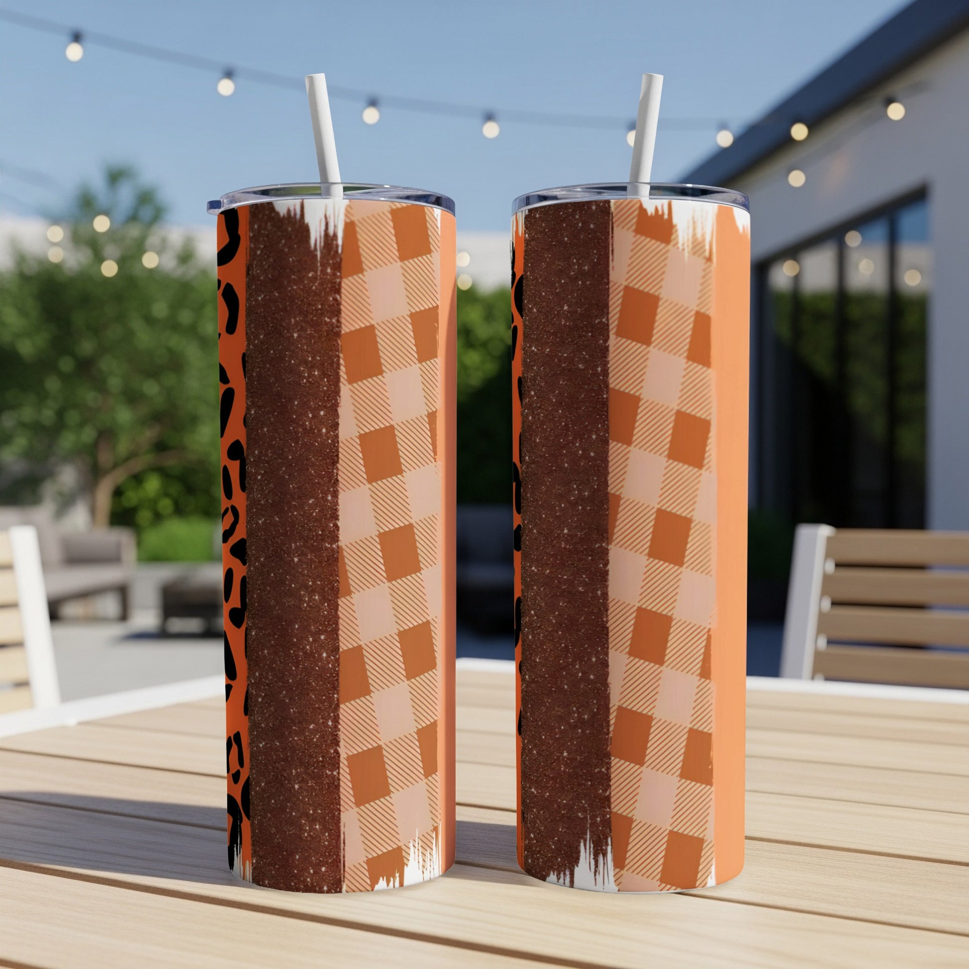 Two tall tumblers with leopard print and orange plaid patterns.