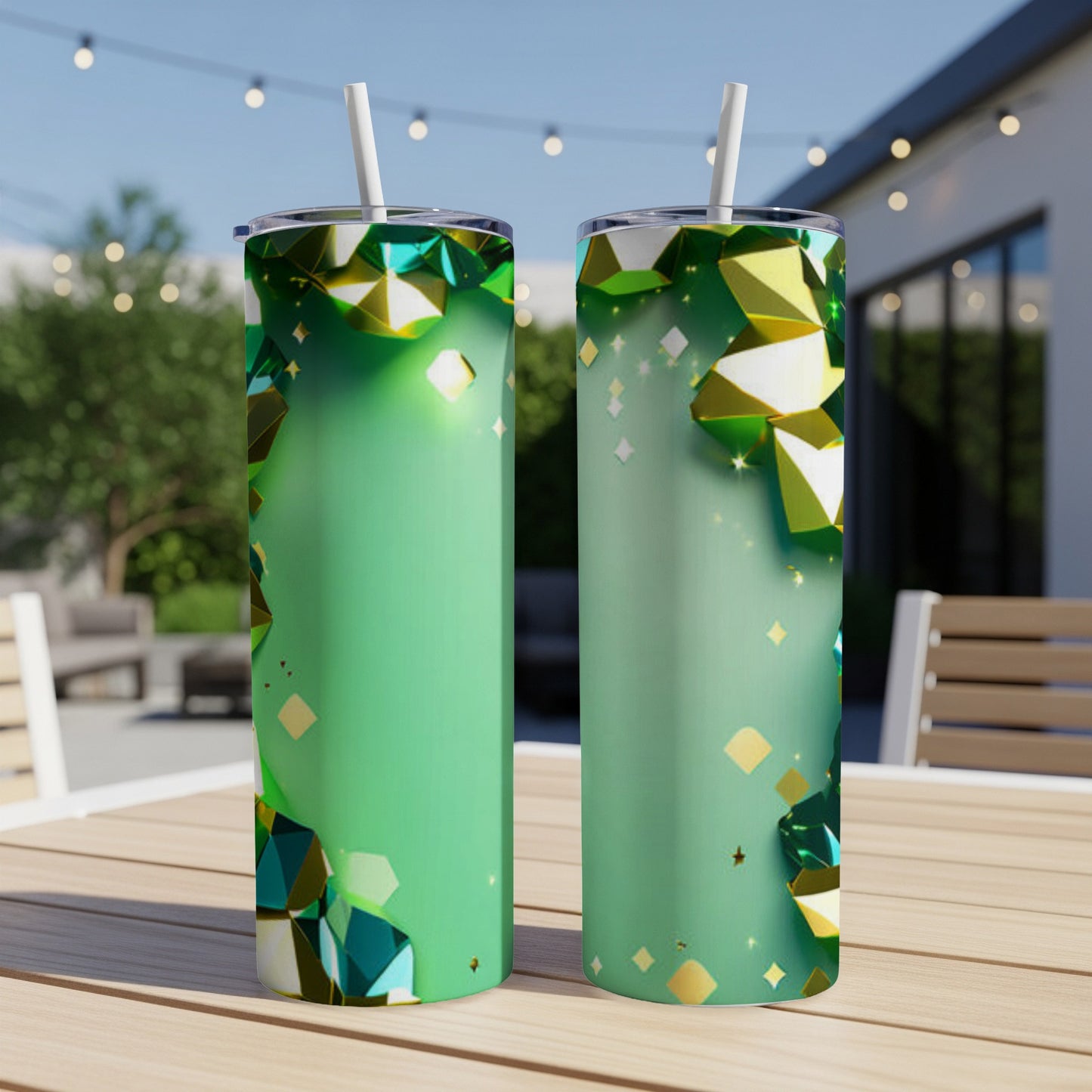 Green tumblers with jewel and diamond patterns on outdoor table.