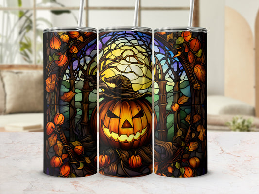 Halloween jack-o'-lantern tumbler with witch hat and spooky trees.