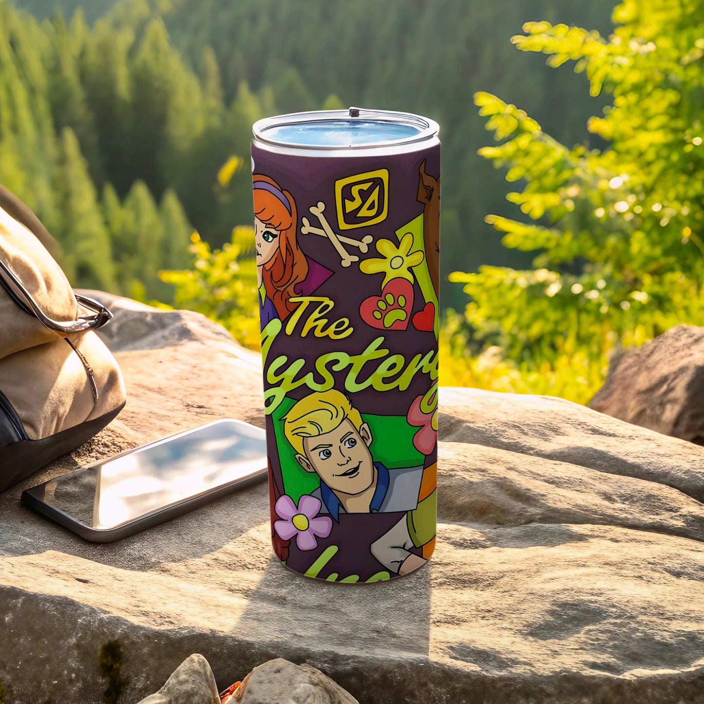 Scooby-Doo character collage on purple tumbler with outdoor background.