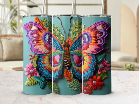 Three tumblers with vibrant, detailed butterfly and floral designs.