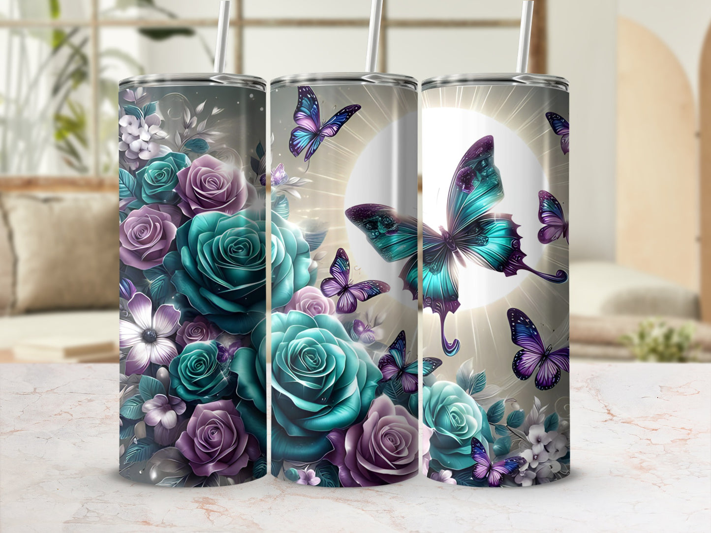 Three tumblers with a floral and butterfly design in teal and purple.