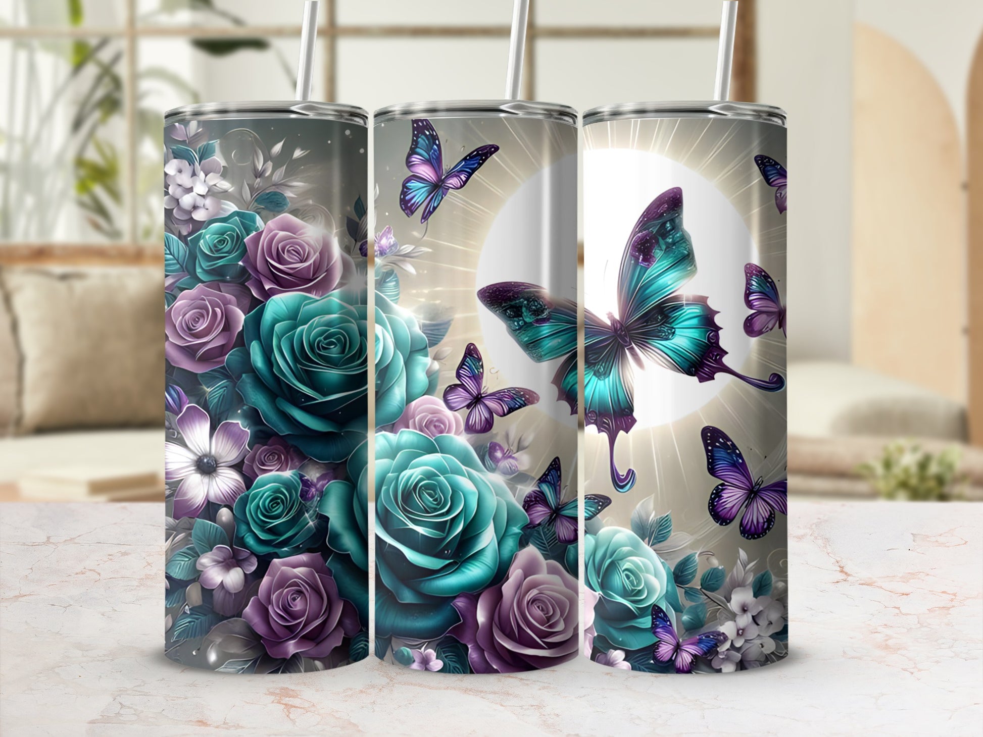 Three tumblers with a floral and butterfly design in teal and purple.