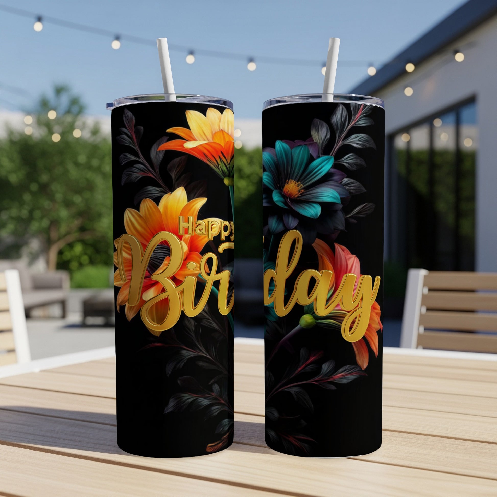 Two black tumblers with "Happy Birthday" in gold lettering and floral accents.
