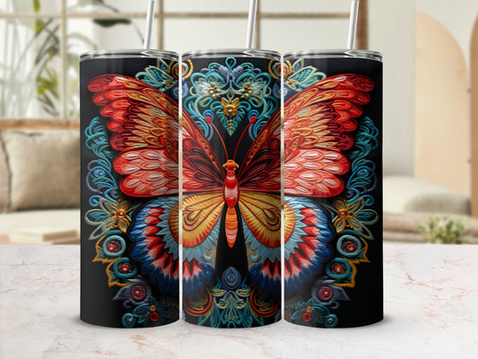 Tumbler with vibrant butterfly and floral embroidery design on black.