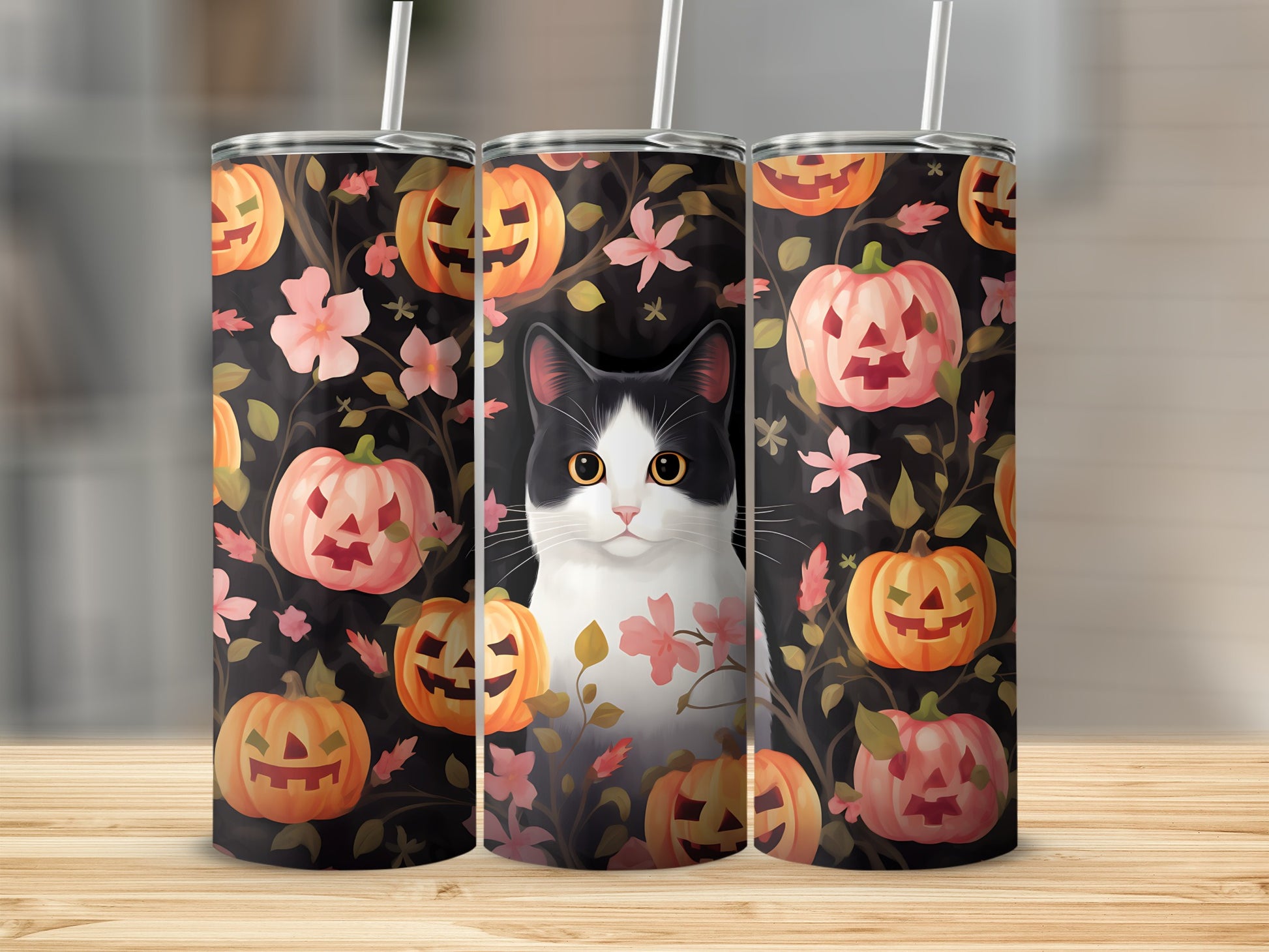 Black and white cat with pumpkins and flowers on a Halloween-themed tumbler.