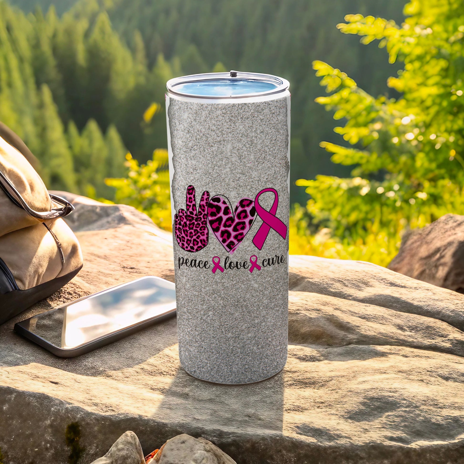 Gray speckled tumbler with peace, love, and cure text and pink ribbons.
