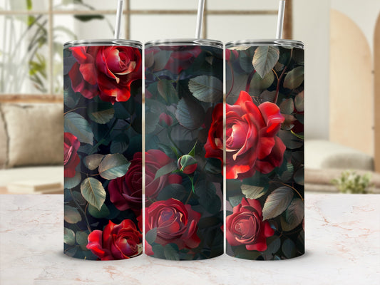 Three tumblers with deep red roses and dark green leaves on a patterned background.