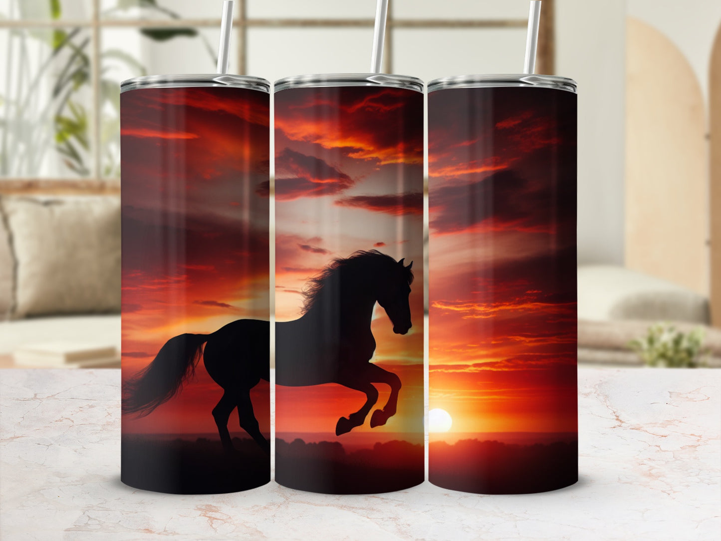 Silhouette of a horse galloping across a sunset landscape on three tumblers.