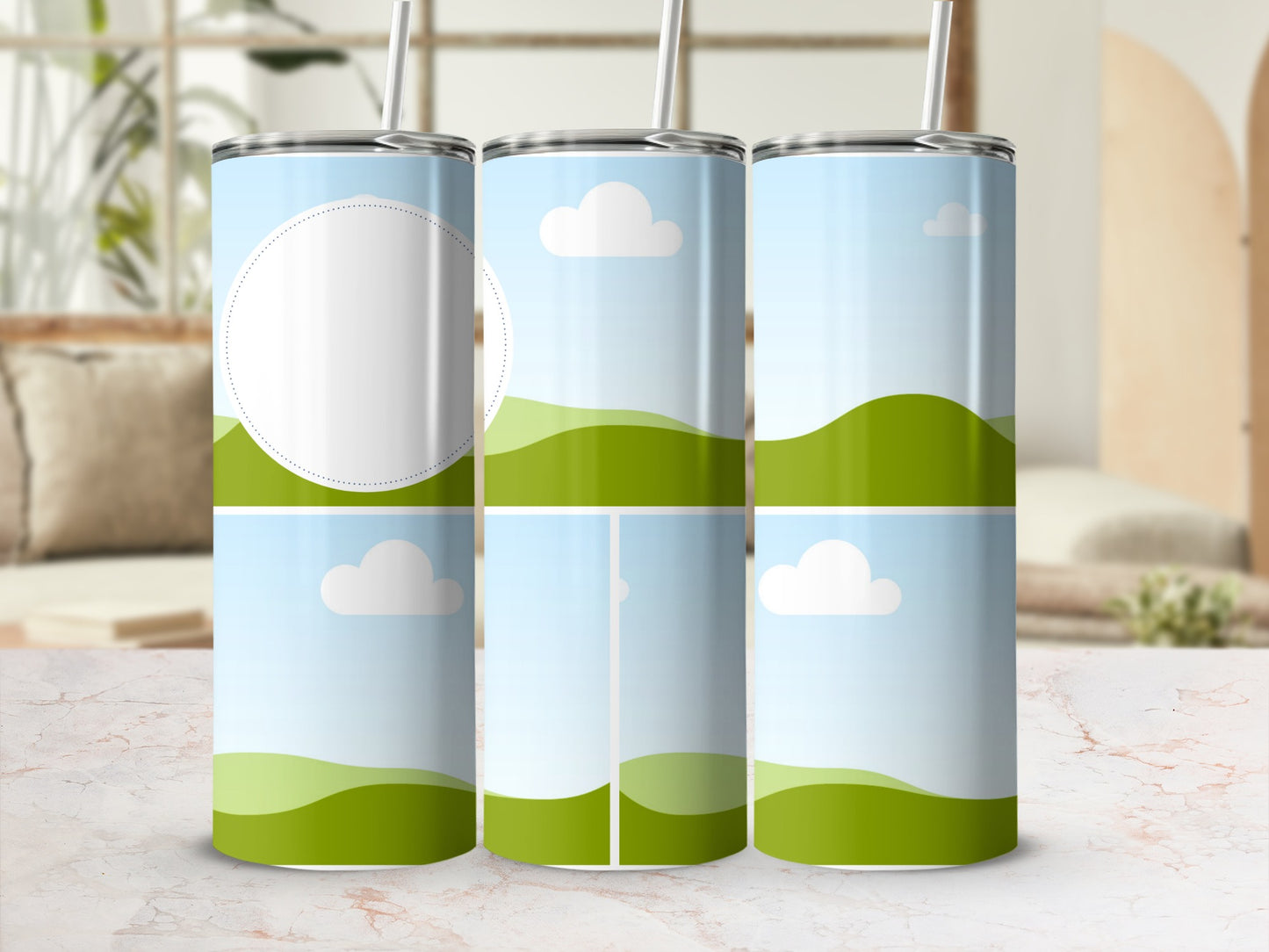 Three tumblers with a rolling green hills and sky design, one with a blank circle.