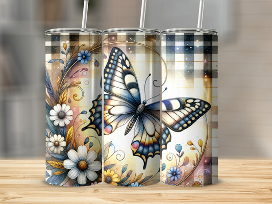 Three tumblers with butterfly and floral designs on a wooden surface.
