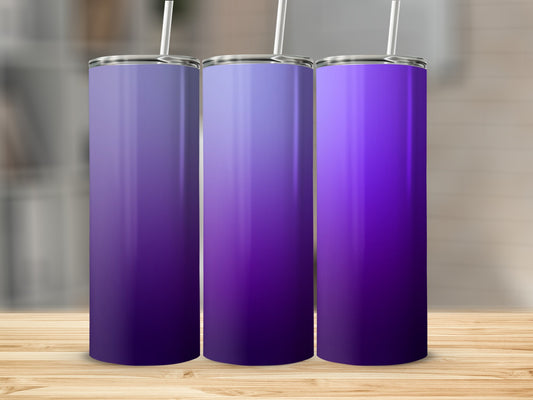 Three tall, slim tumblers with purple ombre gradient designs and straws.