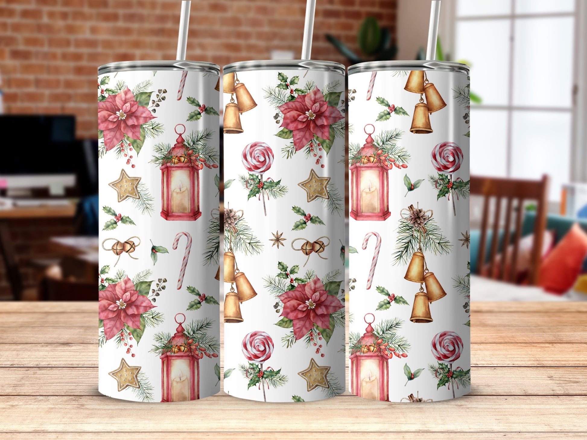 Christmas tumbler with poinsettias, lanterns, candy canes, and bells.