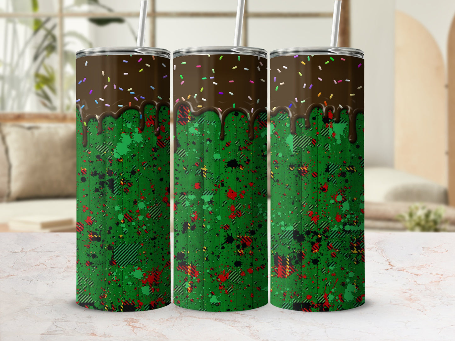 Green tumbler with chocolate drip and colorful sprinkles, plaid and splatter design.