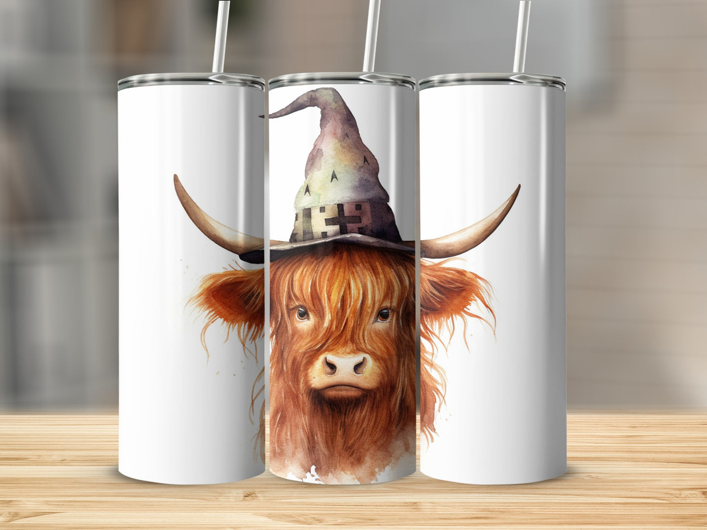 Watercolor highland cow wearing a witch hat with "BOO" on it.