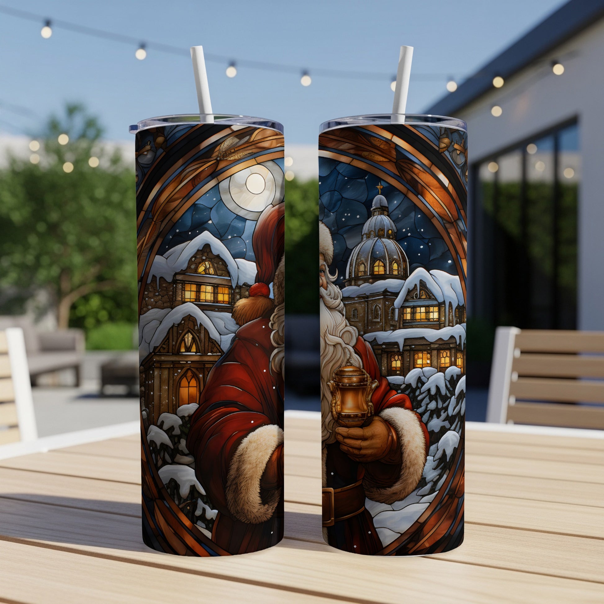 Two Santa Claus tumblers with snowy village scene design.
