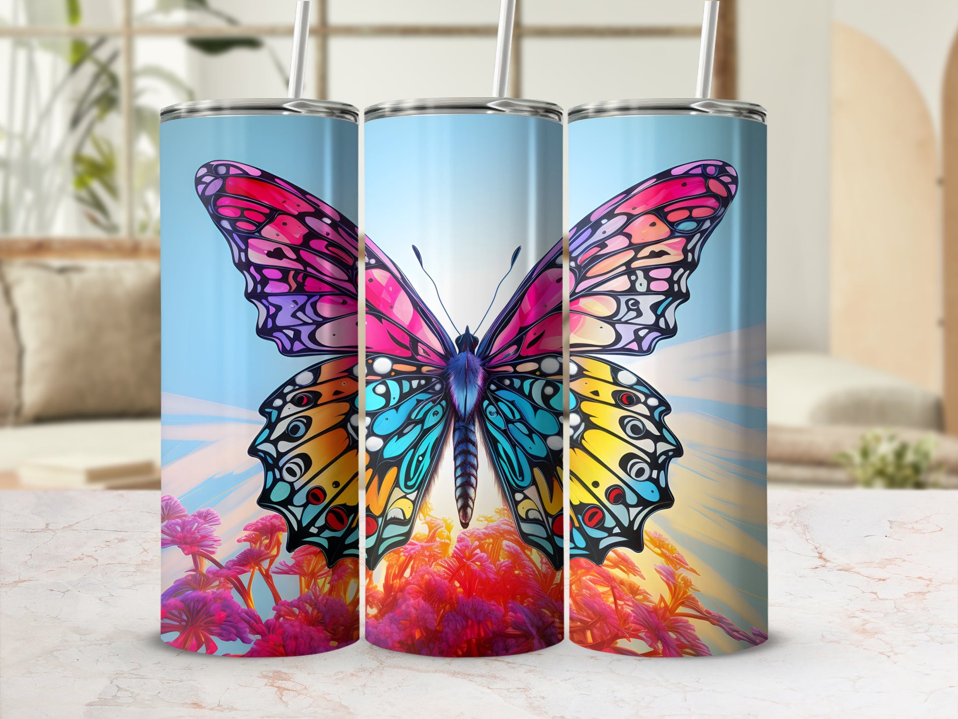 Colorful butterfly design on a blue gradient tumbler with straw.