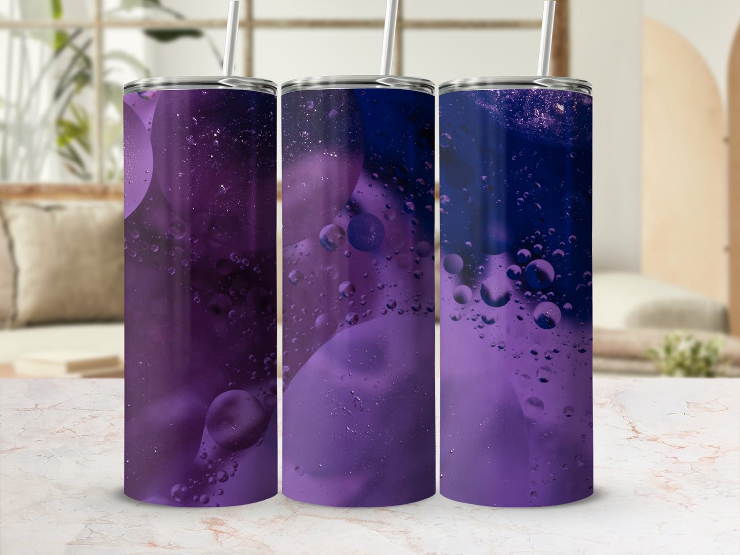 Three purple tumblers with oil and water bubble design.