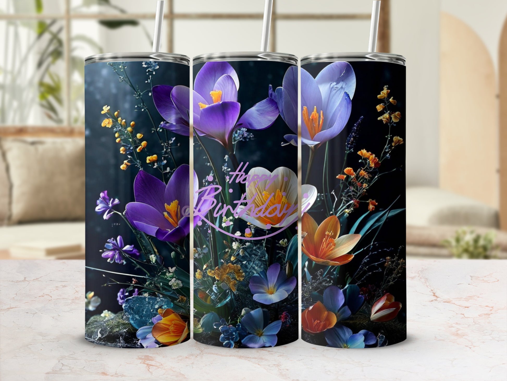 Three tumblers with a vibrant floral design featuring purple and orange flowers and "Happy Birthday" text.