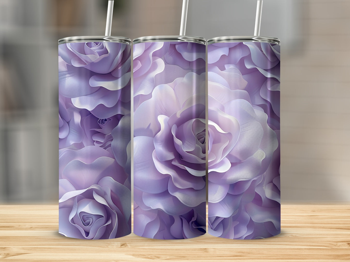 Three purple floral tumblers with rose petal patterns on a wooden surface.