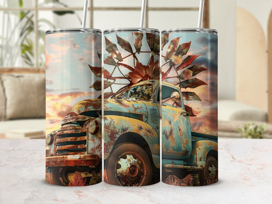 Rusty vintage truck with windmill in a sunset landscape.