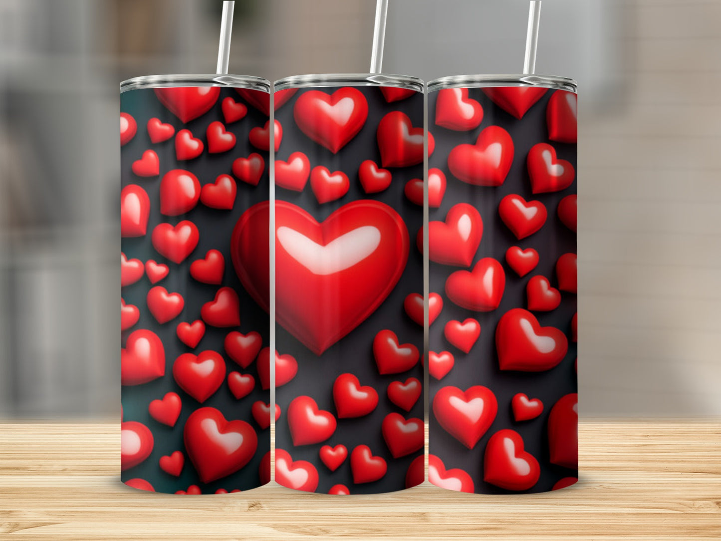 Trio of tumblers with scattered red and white hearts on a dark background.