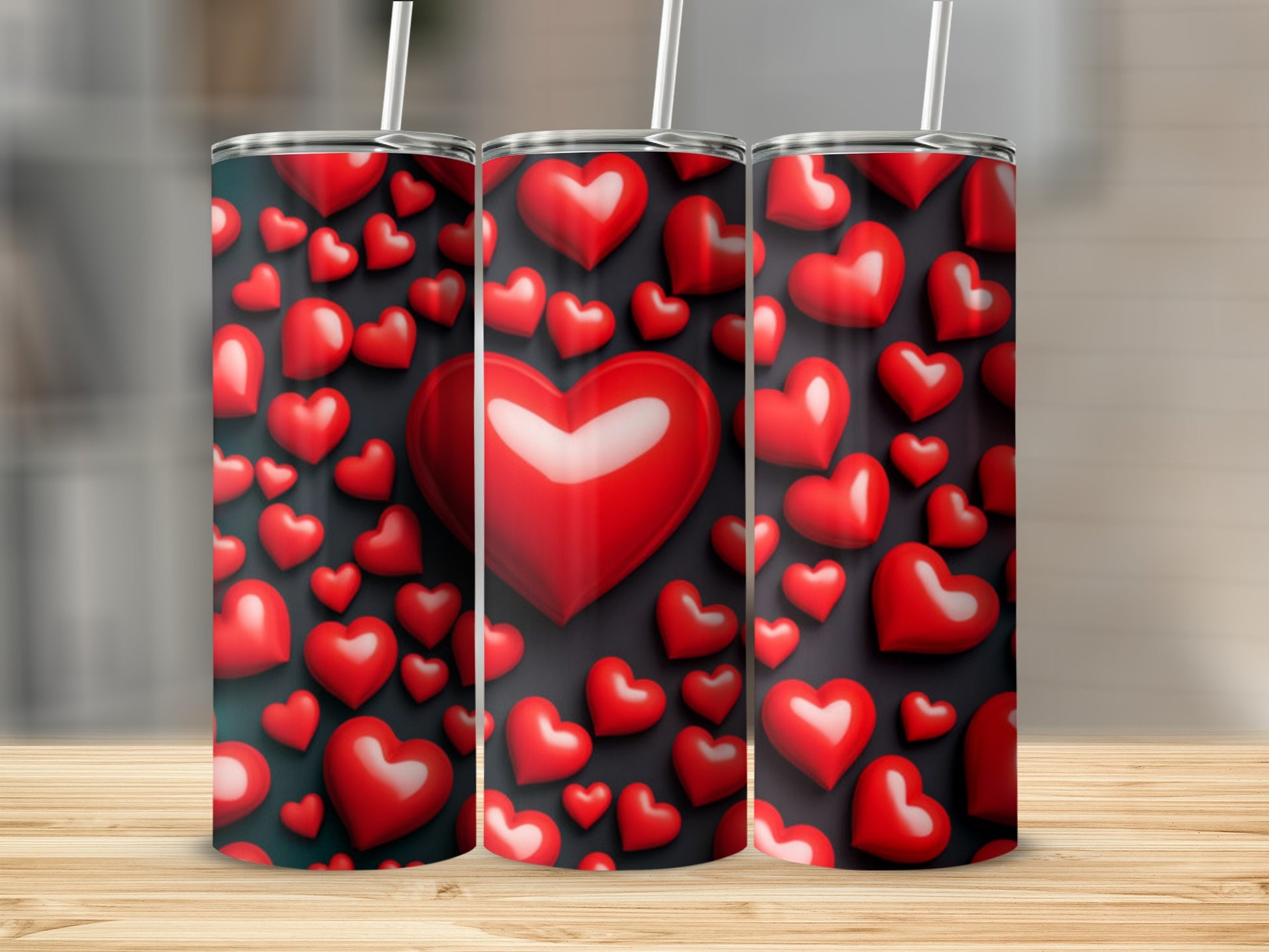 Trio of tumblers with scattered red and white hearts on a dark background.
