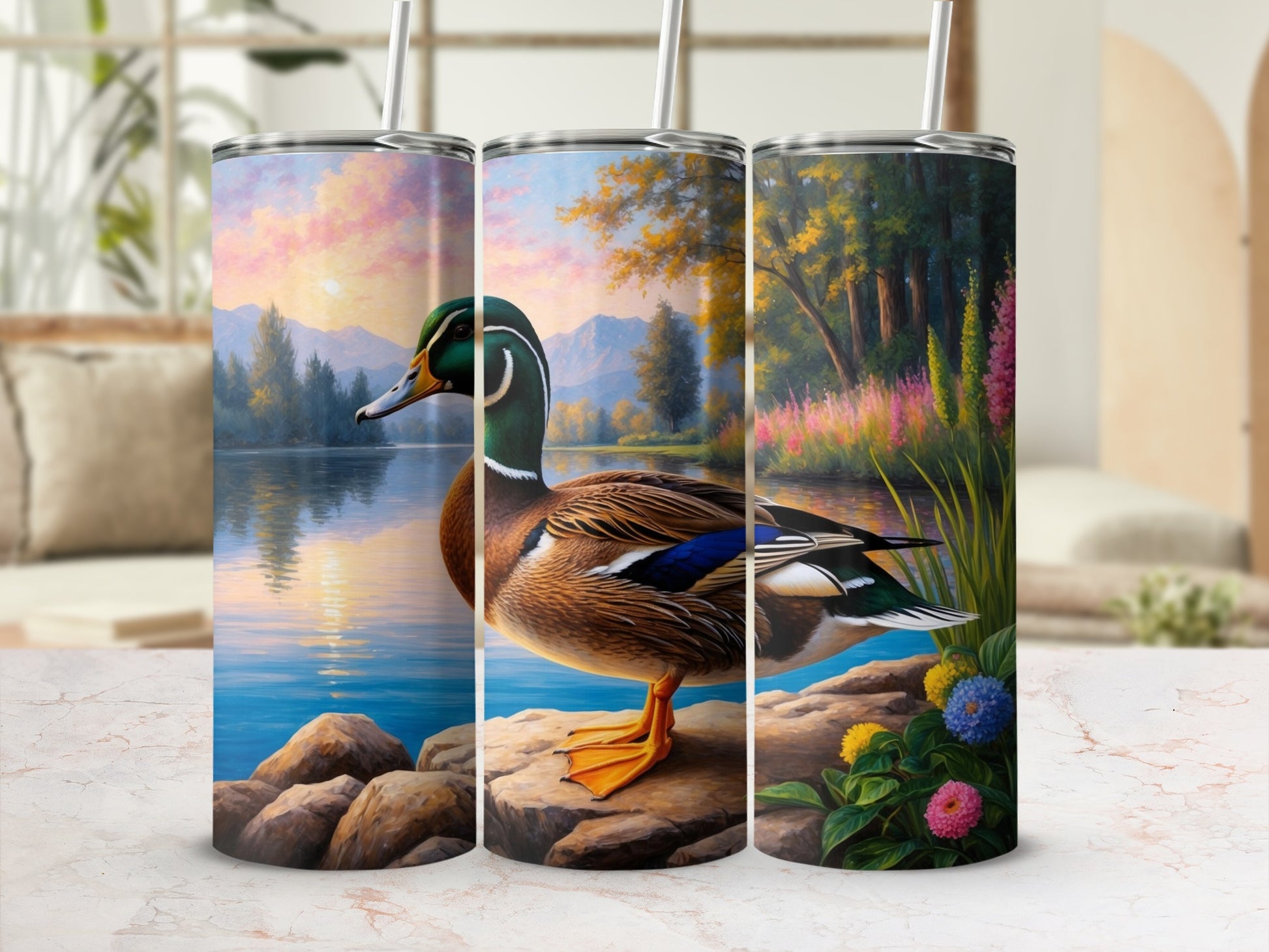 Triptych of tumblers featuring a detailed painting of a duck by a rocky lake with colorful flowers.