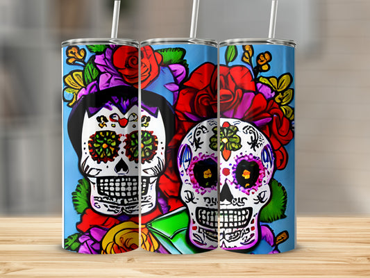 Three tumblers with colorful sugar skull designs and red roses.