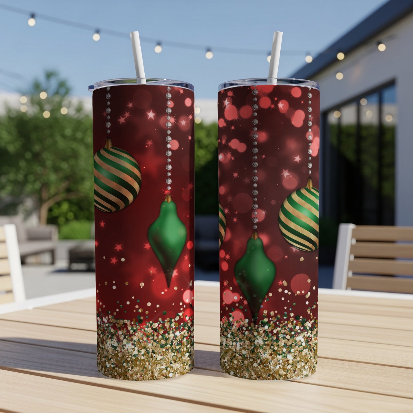 Two tall, slender tumblers with a red, glittery Christmas ornament design.