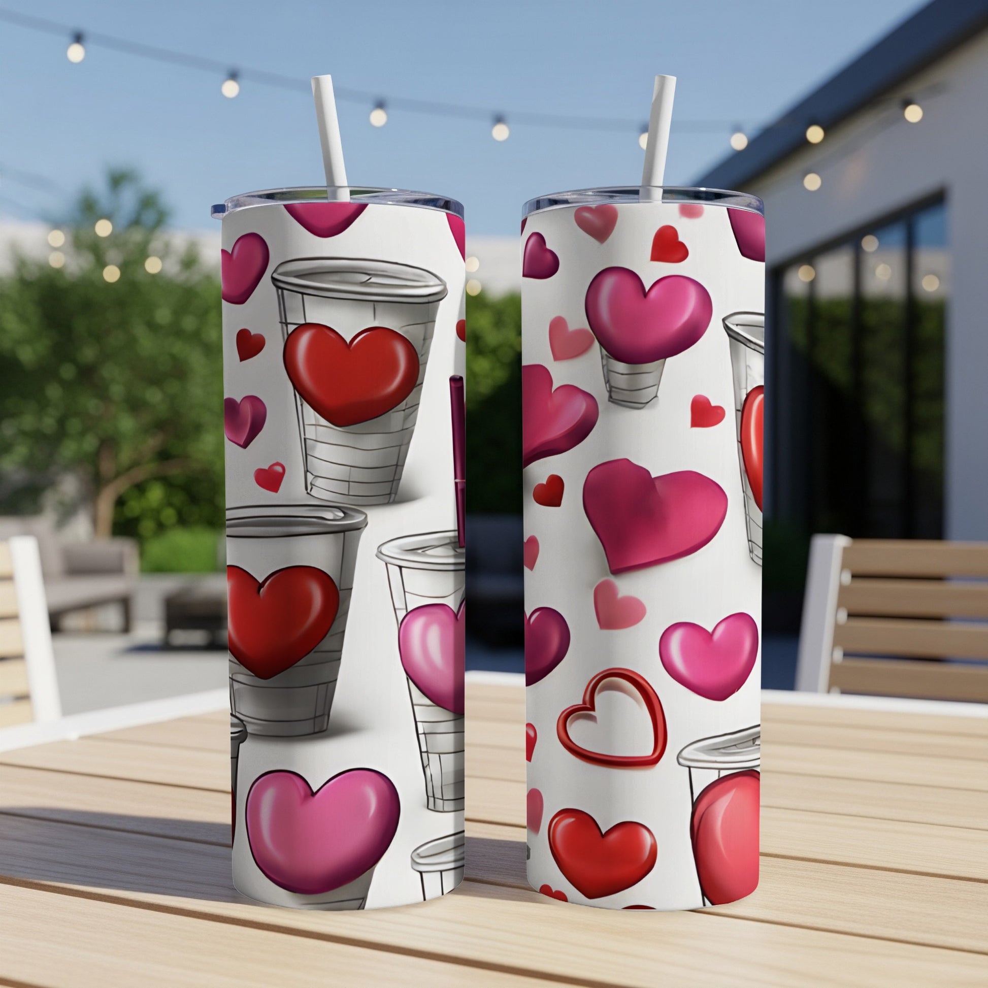 Two tumblers with a pattern of red and pink hearts and coffee cups.