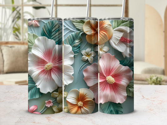 Three tall tumblers adorned with raised floral designs and straws.