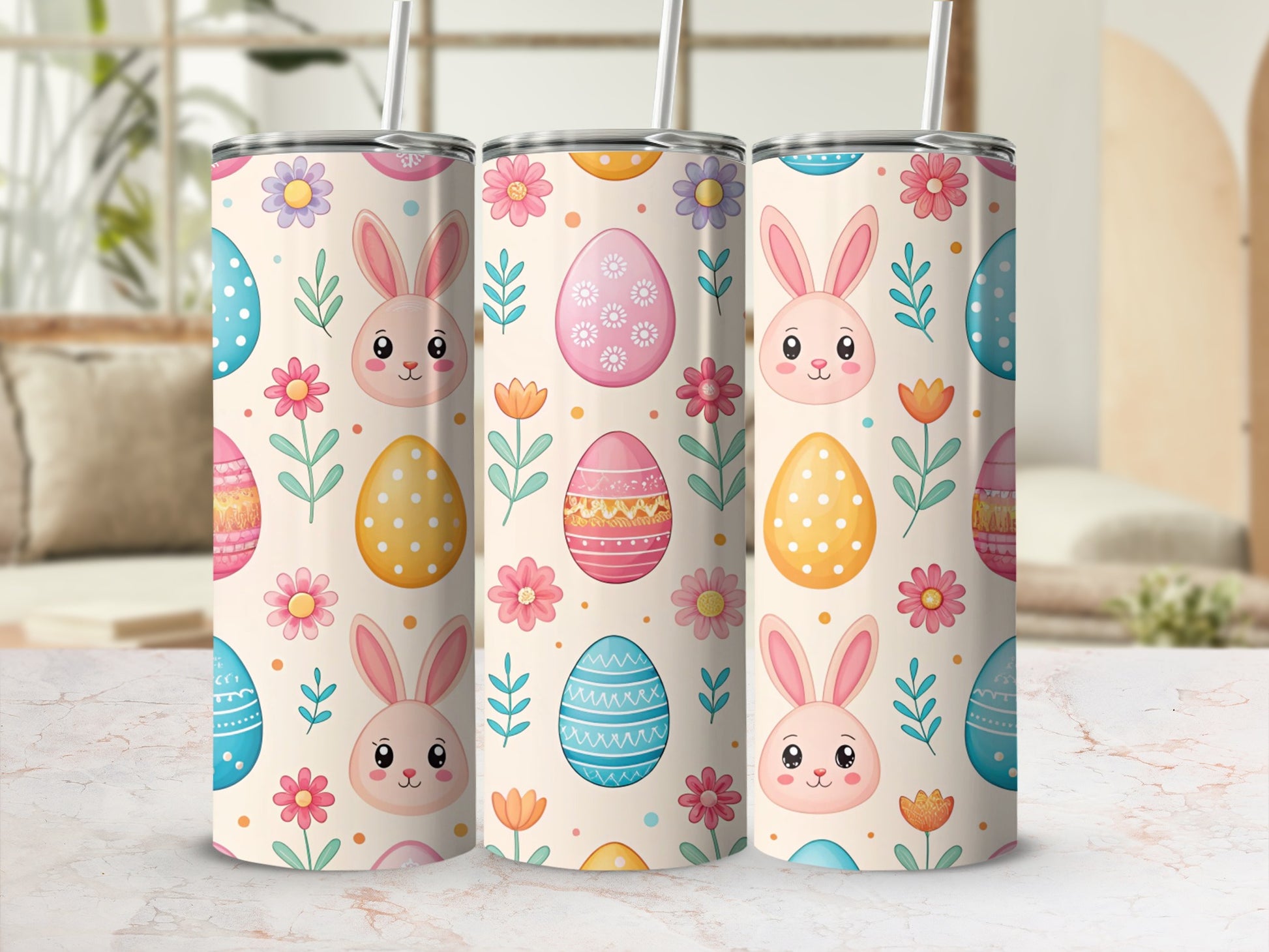 Three Easter-themed tumblers with bunnies, eggs, and flowers on a blurred background.